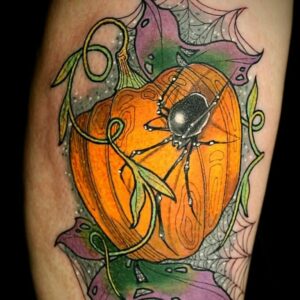 pumpkin tattoo with spider by yasmin ellis tattoo artist in norwich
