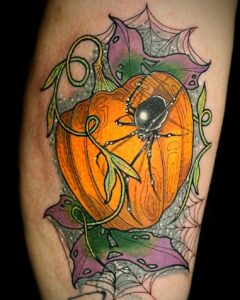 pumpkin tattoo with spider by yasmin ellis tattoo artist in norwich